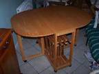 DROP LEAF table and chairs,  Honey coloured table with 4....